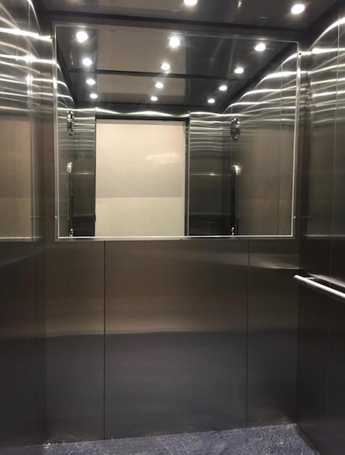 A mirror installed in an elevator by Koala Glass in Newcastle, Australia